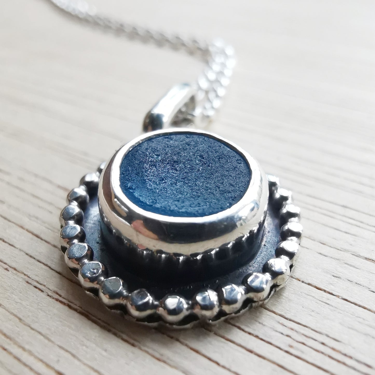 Electric blue sea glass & sterling silver pendant.