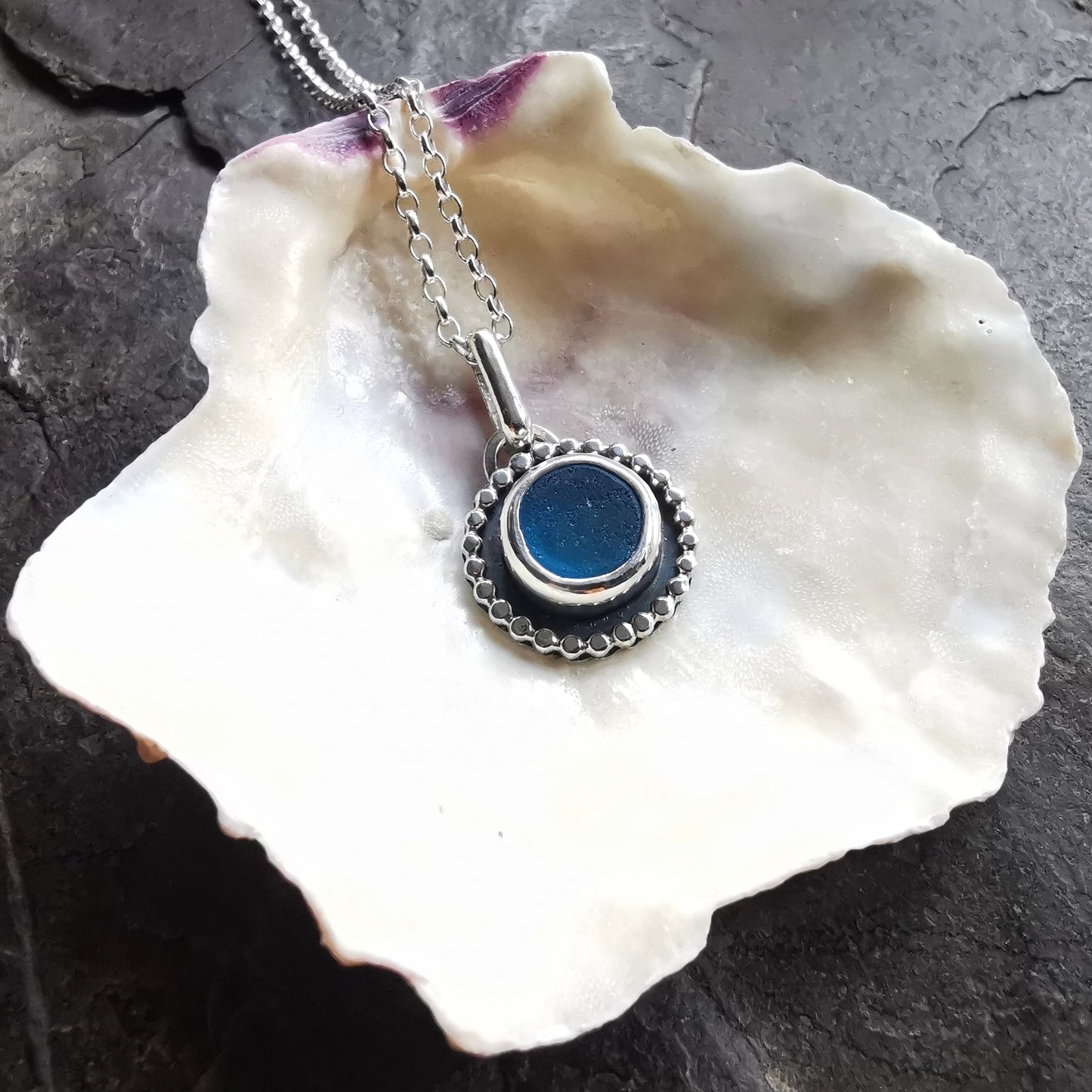 Electric blue sea glass & sterling silver pendant.