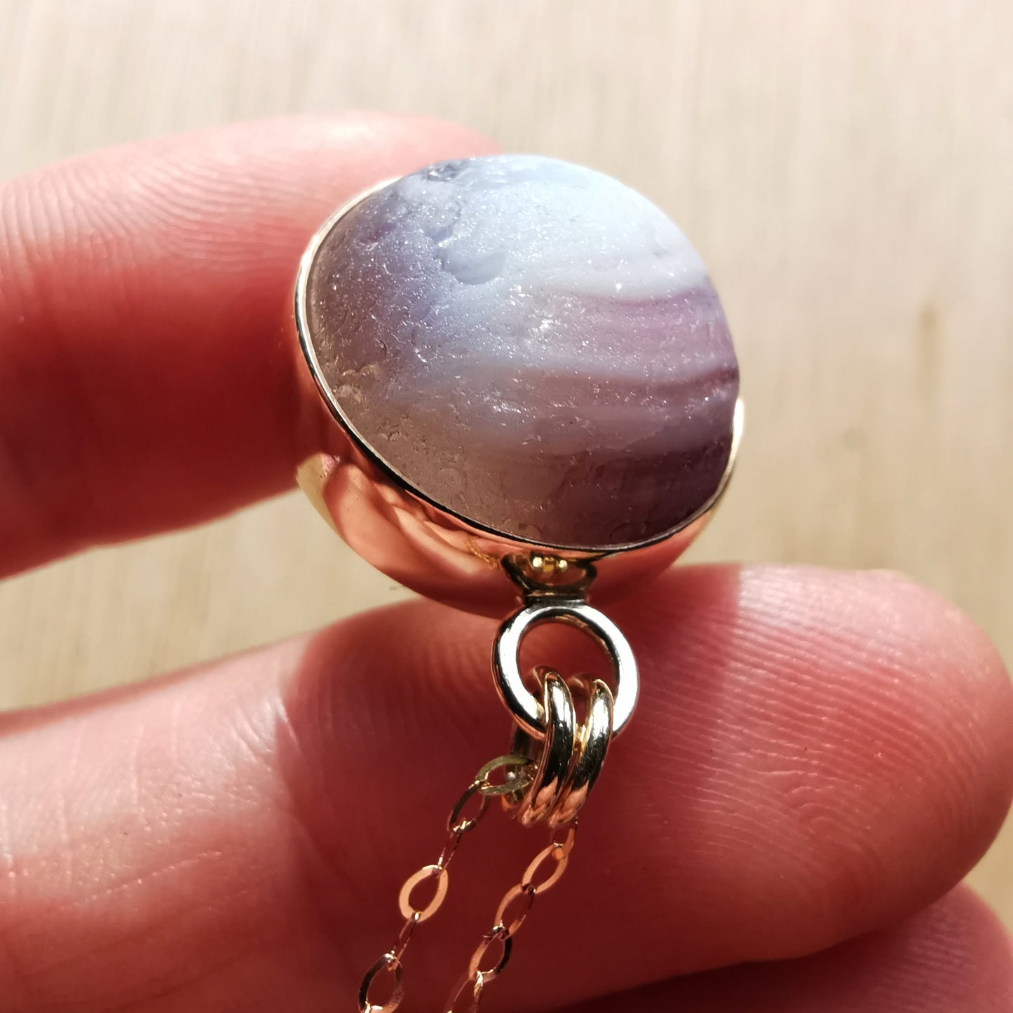 Genuine Scottish opalescent purple sea glass marble & 9 ct gold pendant.