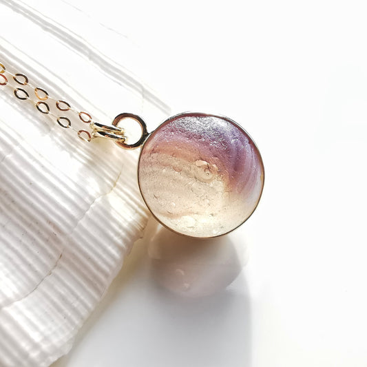 Genuine Scottish opalescent purple sea glass marble & 9 ct gold pendant.