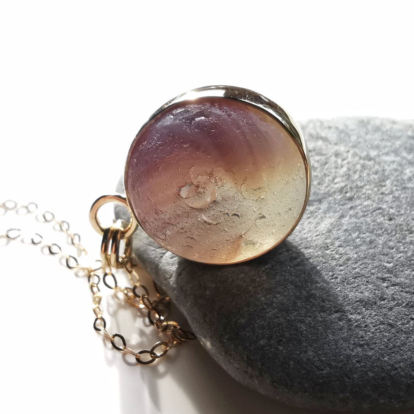 Genuine Scottish opalescent purple sea glass marble & 9 ct gold pendant.