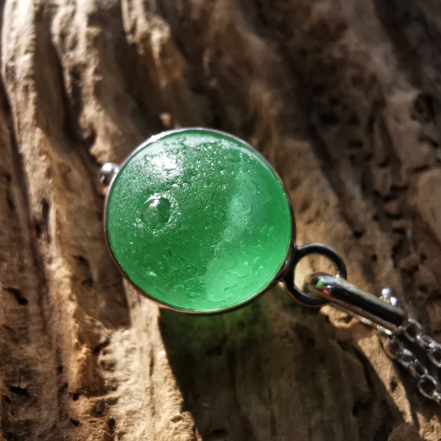 Genuine green sea glass marble & sterling silver pendant.