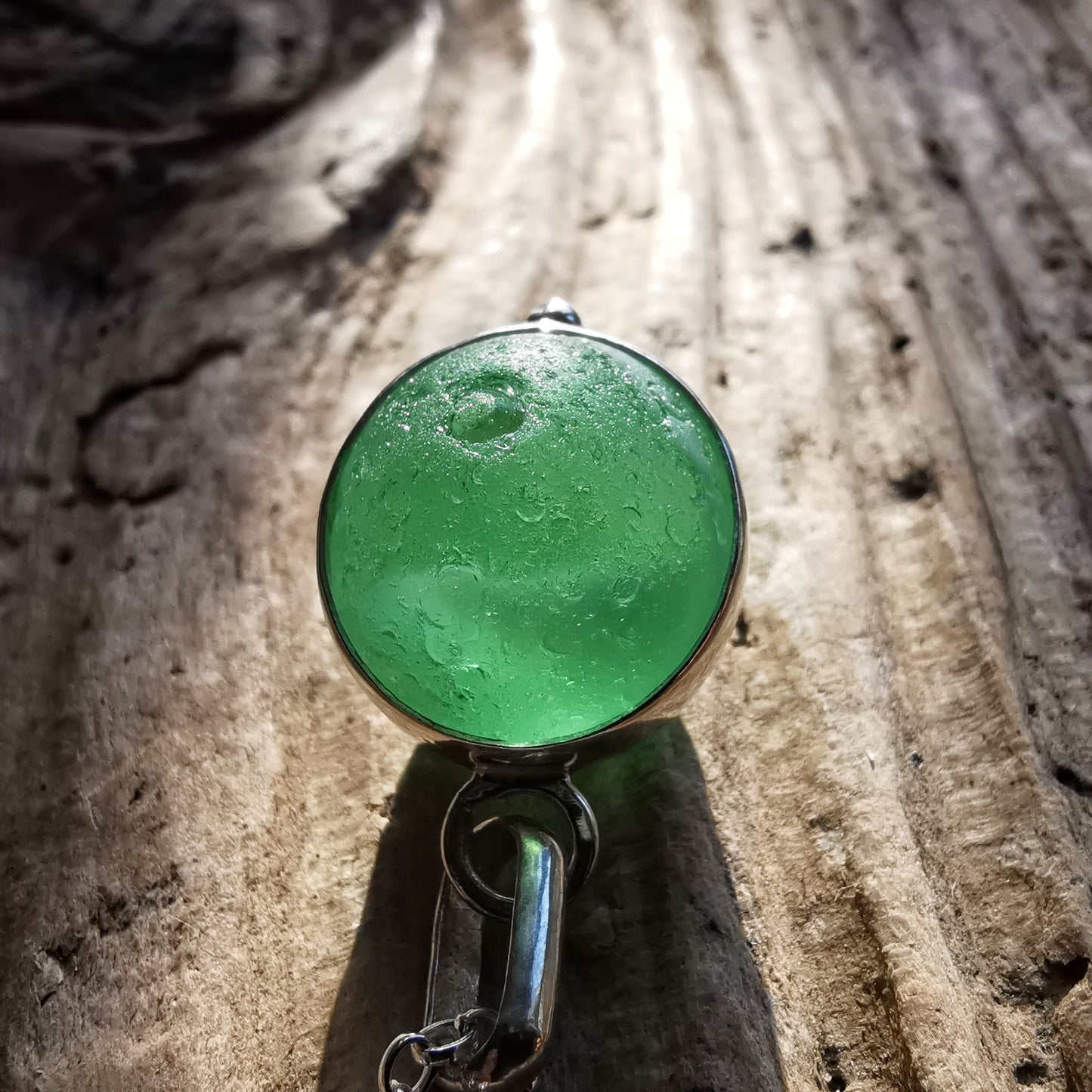 Genuine green sea glass marble & sterling silver pendant.