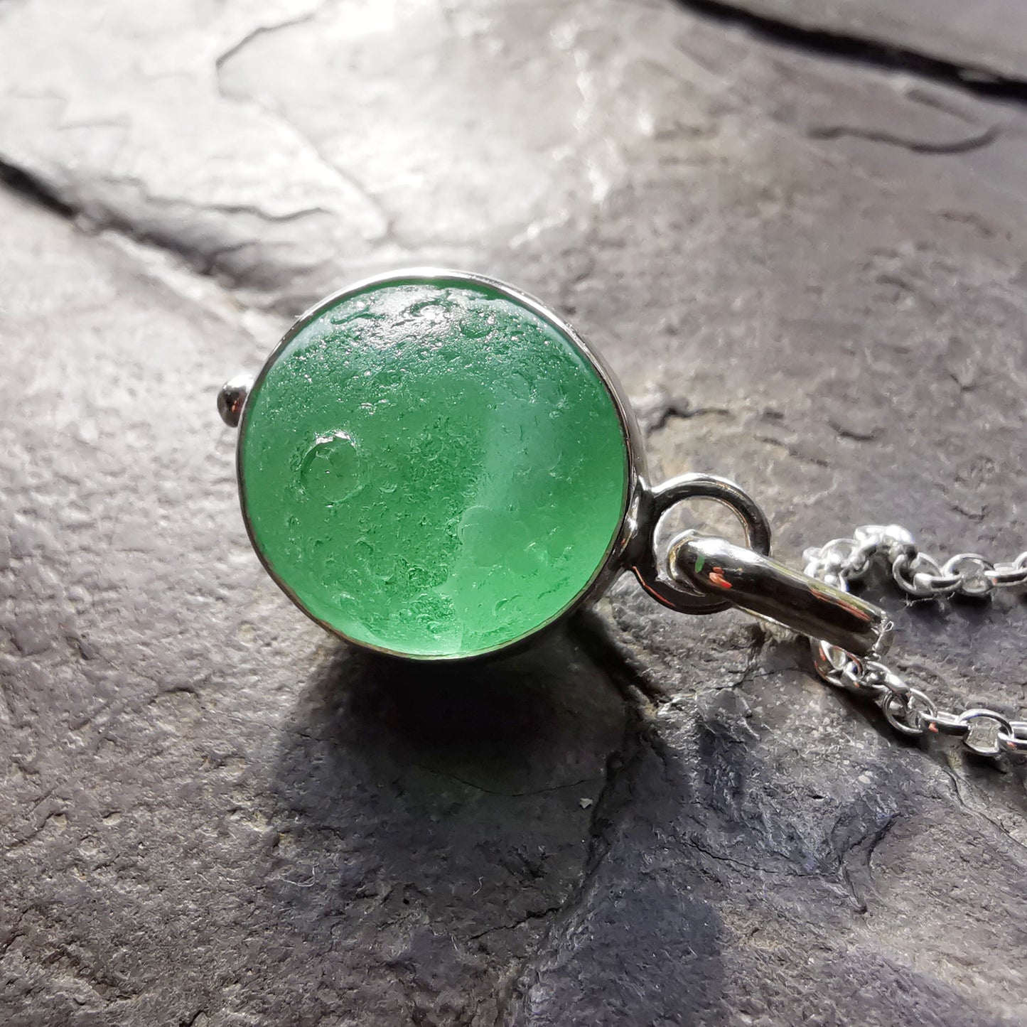 Genuine green sea glass marble & sterling silver pendant.