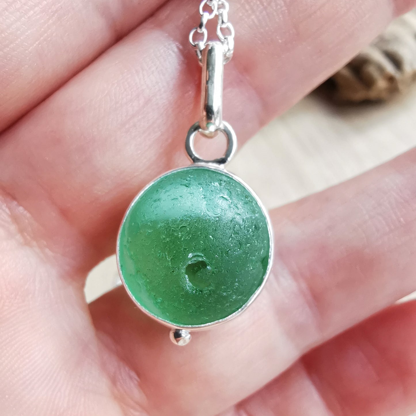 Genuine green sea glass marble & sterling silver pendant.