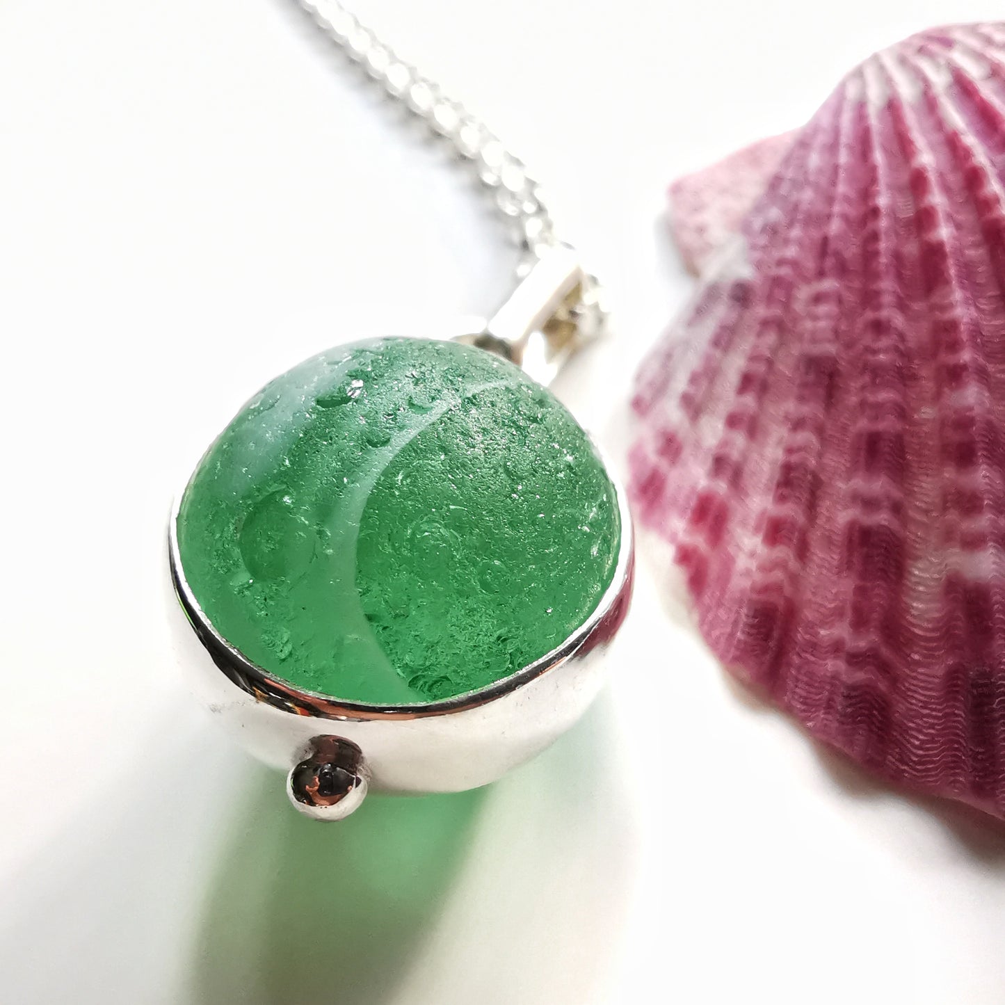 Genuine green sea glass marble & sterling silver pendant.