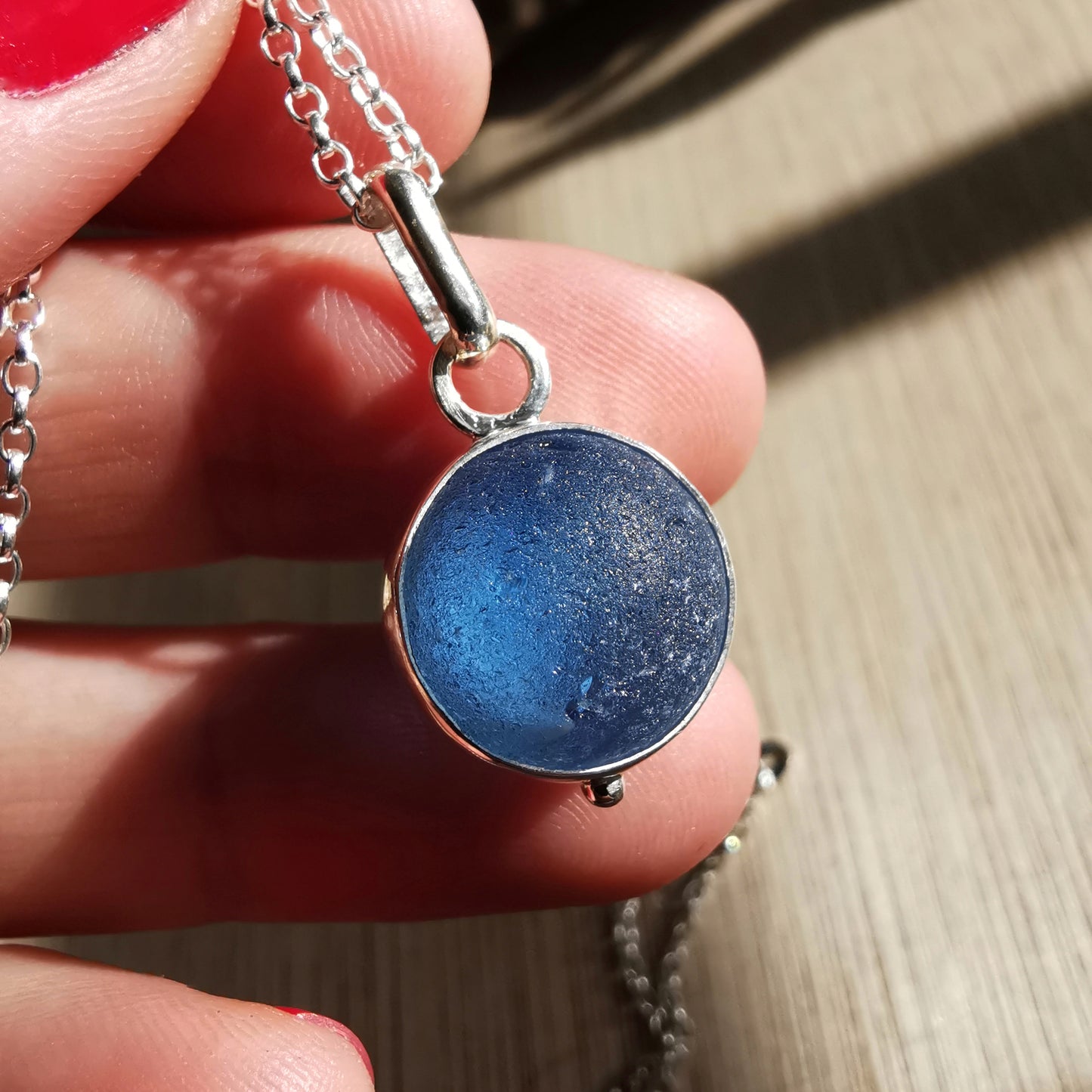 Scottish blue sea glass marble & sterling silver pendant.