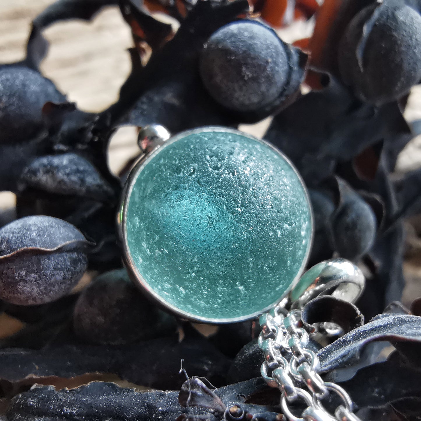 Light blue sea glass marble & sterling silver pendant.