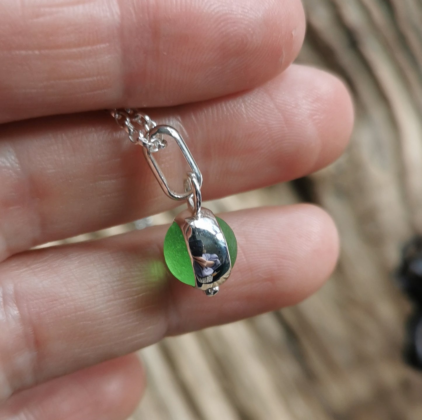 Tiny Scottish green sea glass marble & sterling silver pendant.