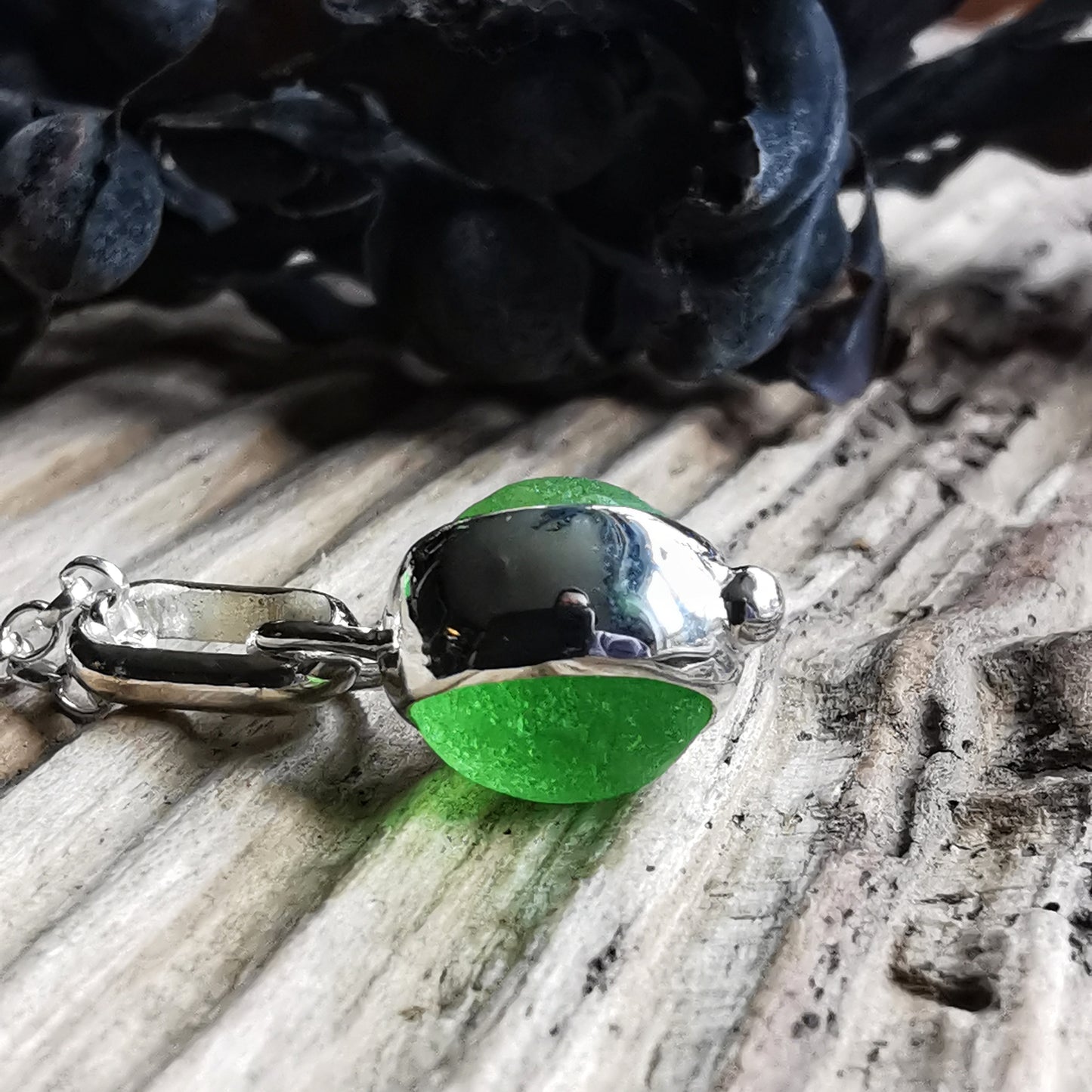 Tiny Scottish green sea glass marble & sterling silver pendant.