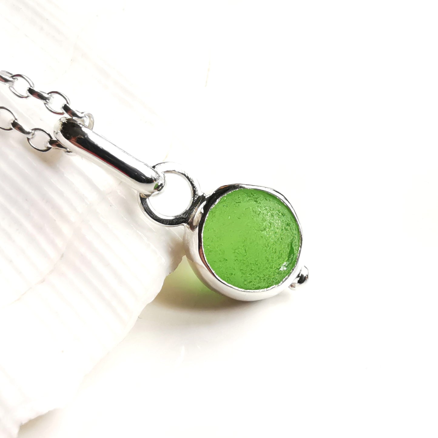 Tiny Scottish green sea glass marble & sterling silver pendant.