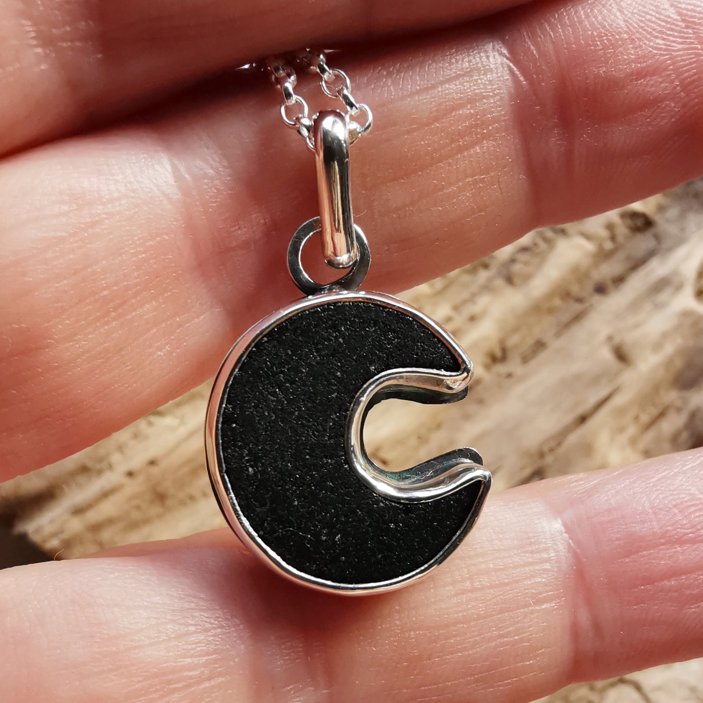 Scottish black crescent moon sea glass & sterling silver pendant.