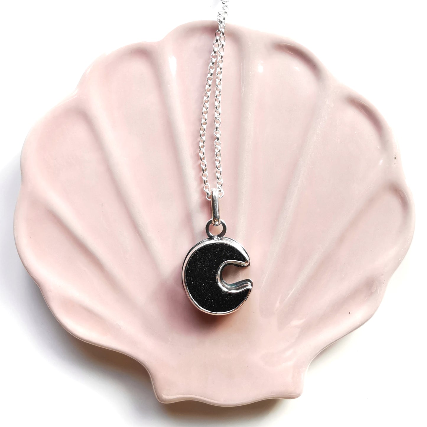 Scottish black crescent moon sea glass & sterling silver pendant.