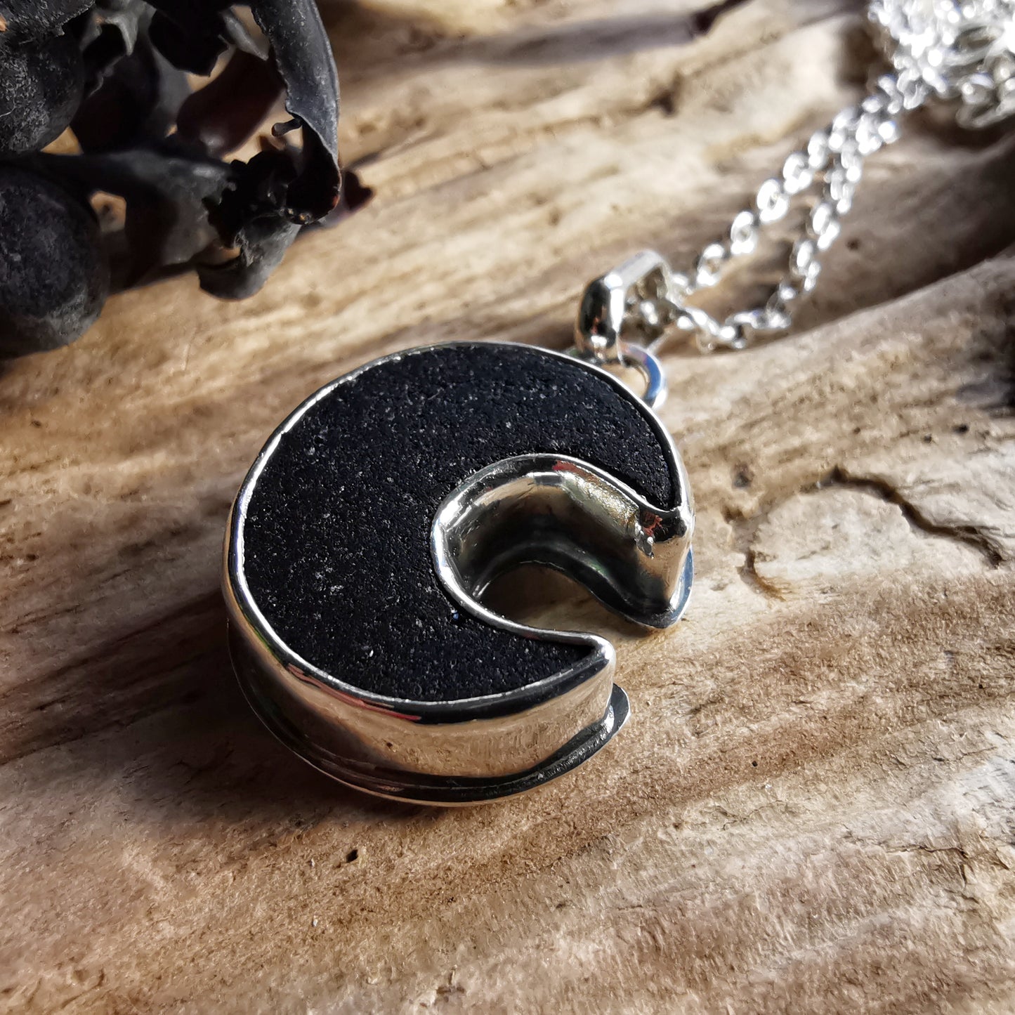 Scottish black crescent moon sea glass & sterling silver pendant.