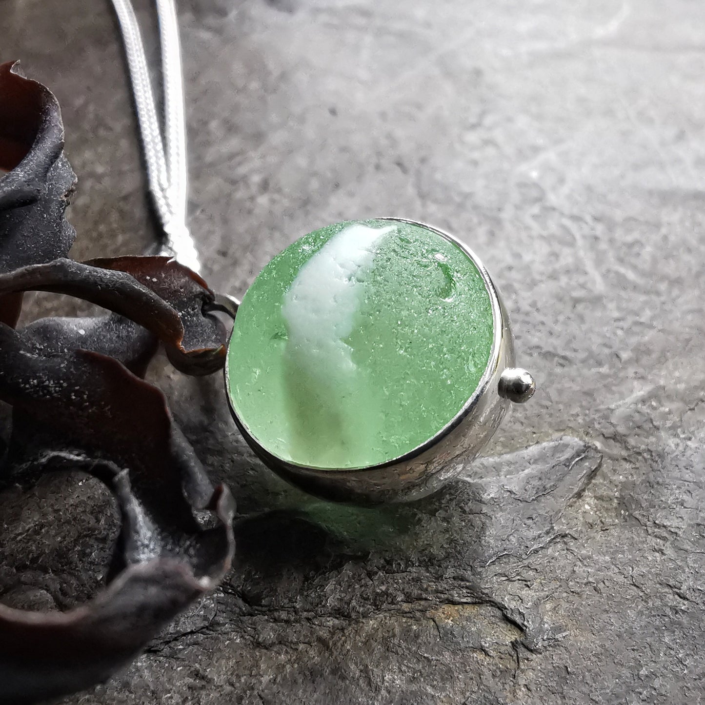 Scottish green and white sea glass marble & sterling silver pendant.