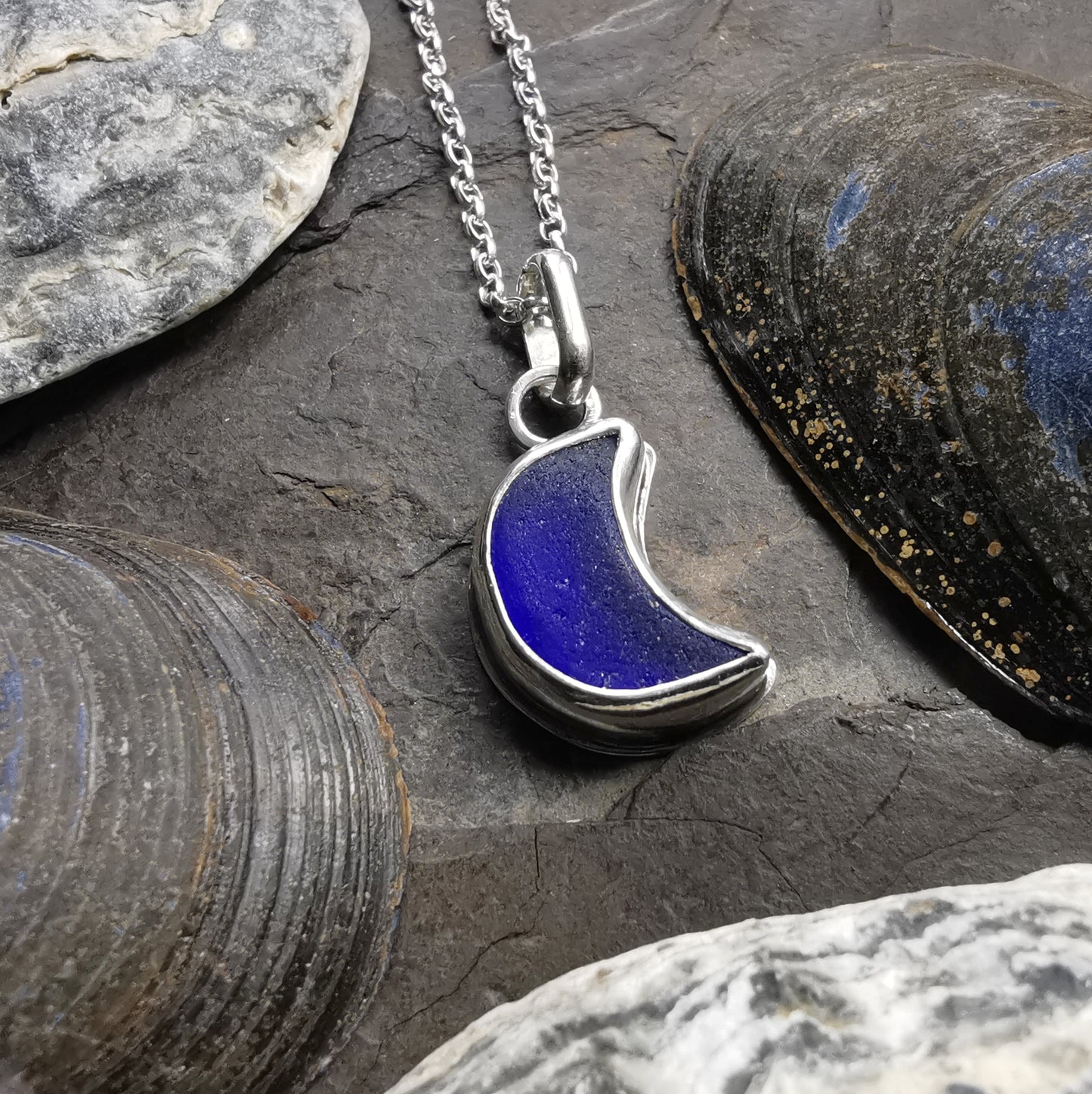 Scottish blue crescent moon sea glass & sterling silver pendant.