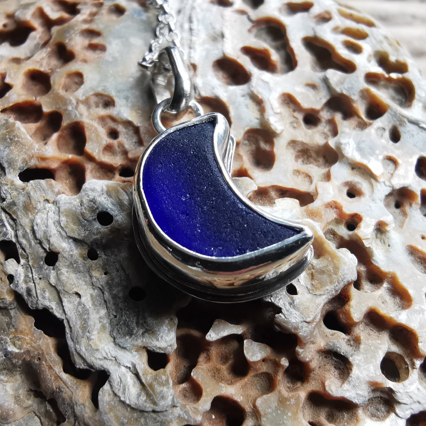 Scottish blue crescent moon sea glass & sterling silver pendant.