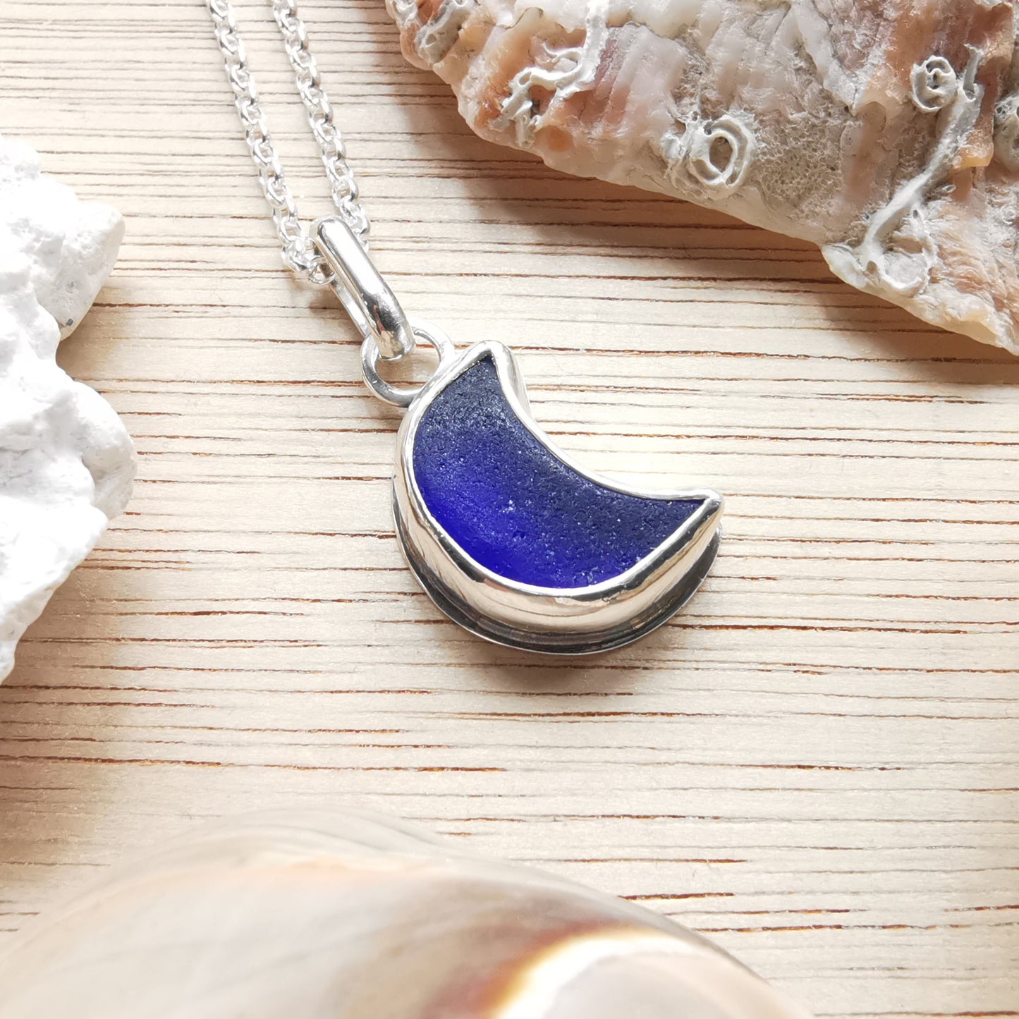 Scottish blue crescent moon sea glass & sterling silver pendant.