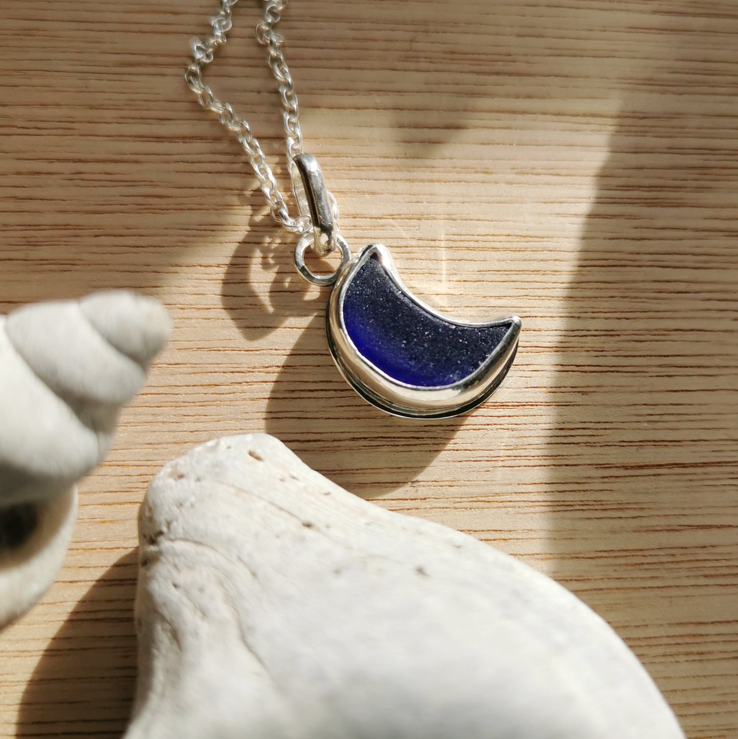 Scottish blue crescent moon sea glass & sterling silver pendant.