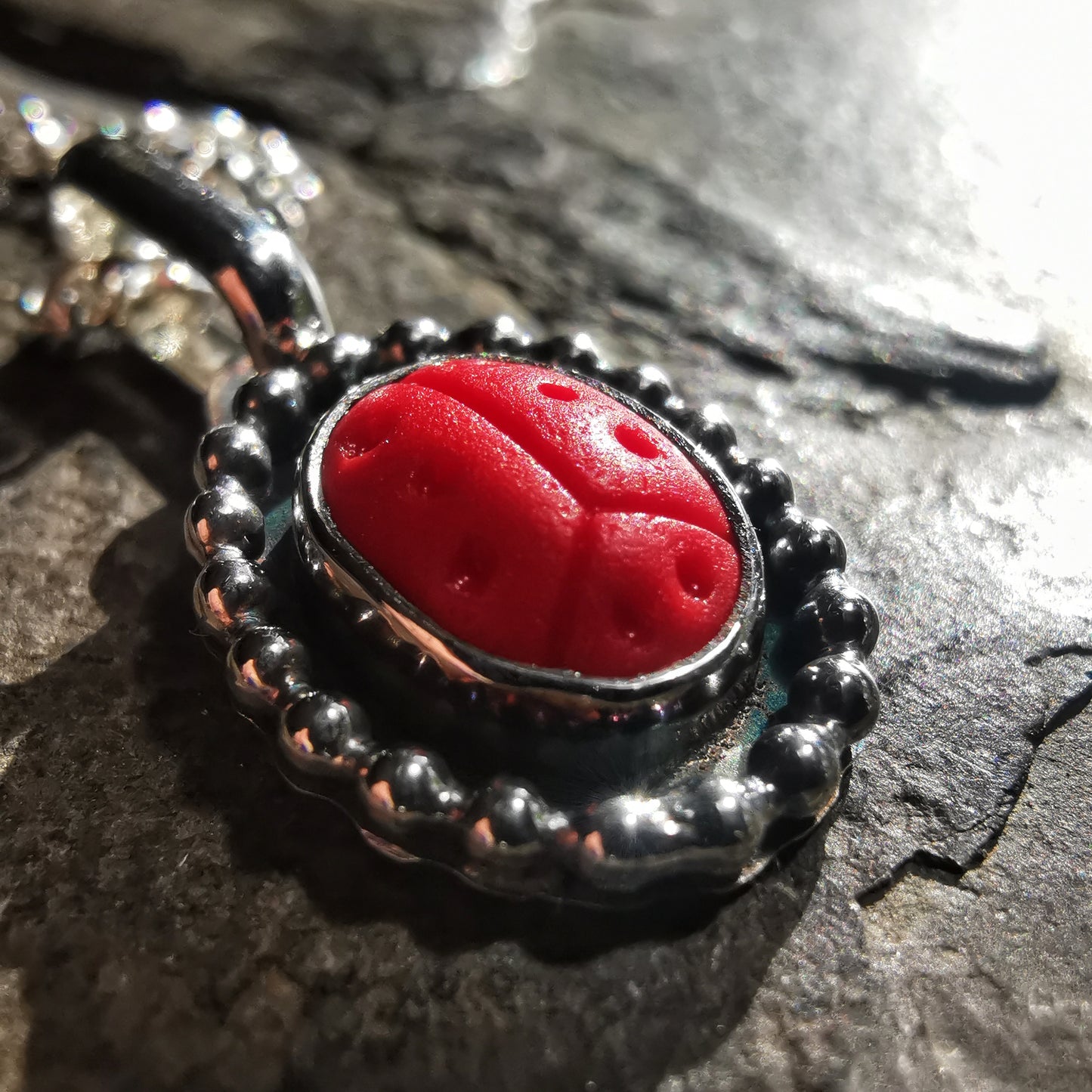 Tiny red sea glass ladybird & sterling silver pendant.