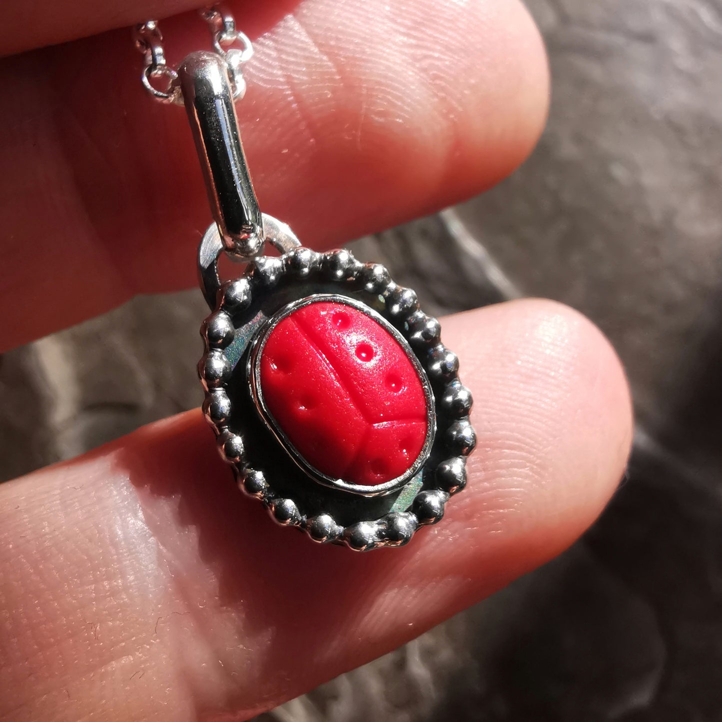 Tiny red sea glass ladybird & sterling silver pendant.