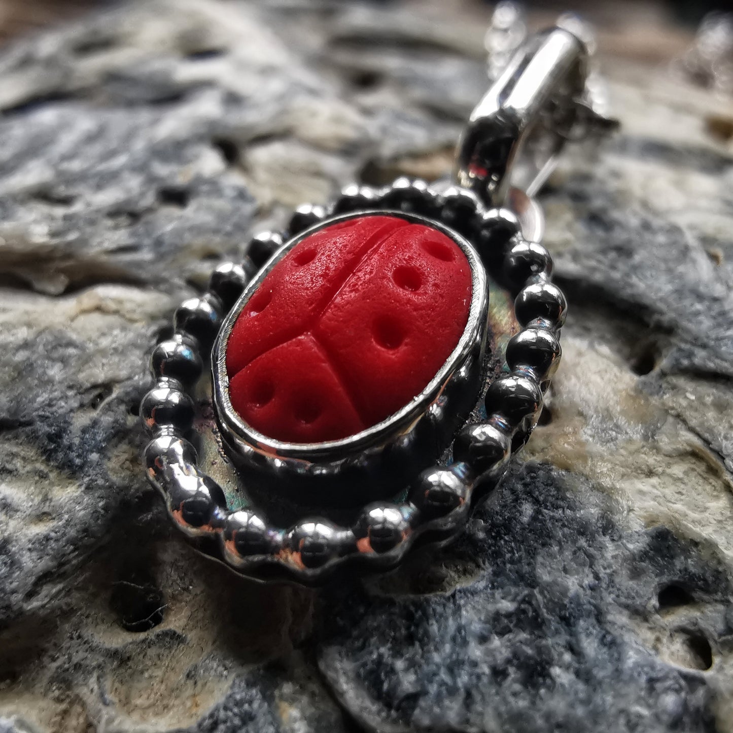 Tiny red sea glass ladybird & sterling silver pendant.