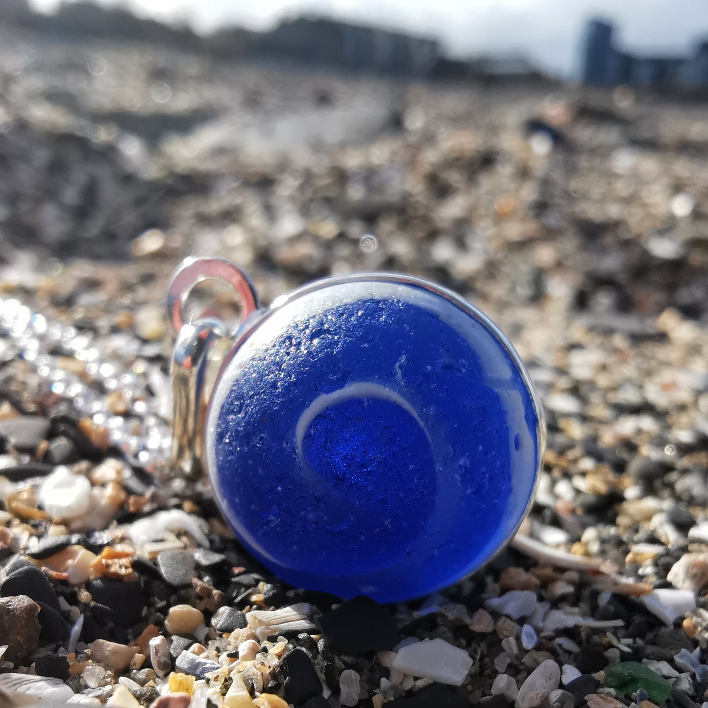 Scottish cobalt blue and white sea glass marble & sterling silver pendant.