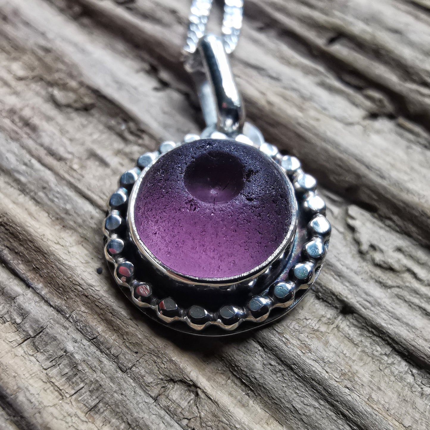 Tiny Scottish purple sea glass button & sterling silver pendant.