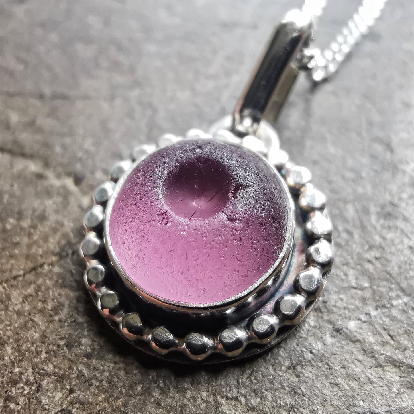 Tiny Scottish purple sea glass button & sterling silver pendant.