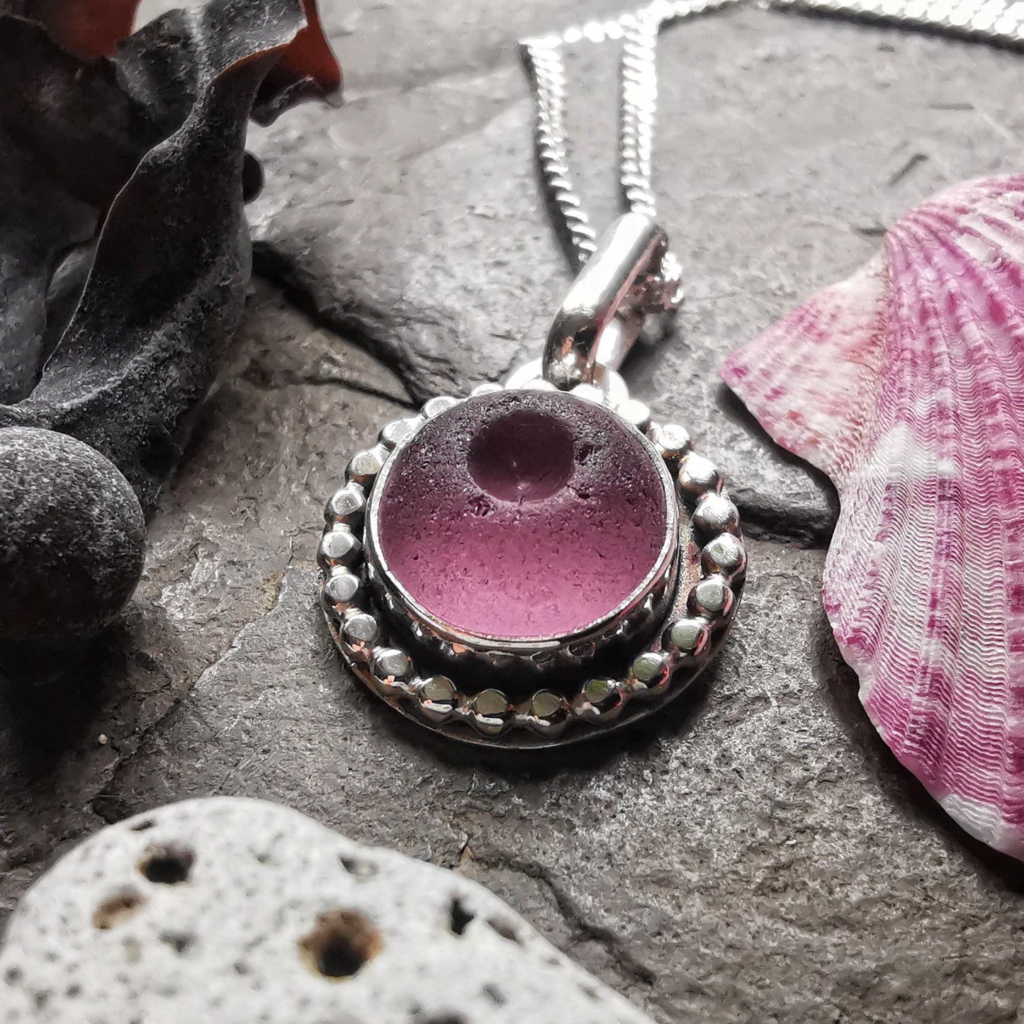 Tiny Scottish purple sea glass button & sterling silver pendant.