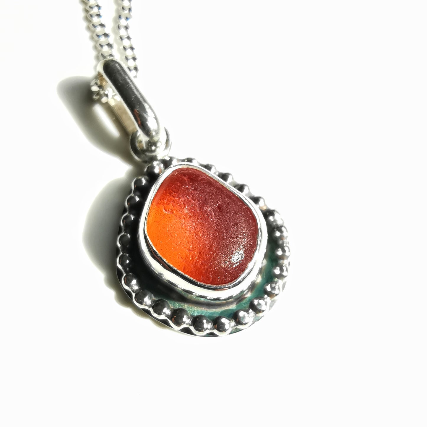 Seaham orange sea glass & sterling silver pendant.