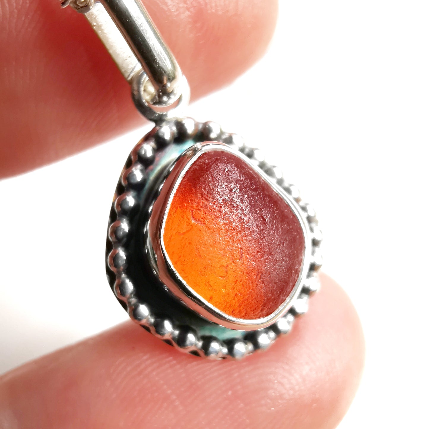 Seaham orange sea glass & sterling silver pendant.