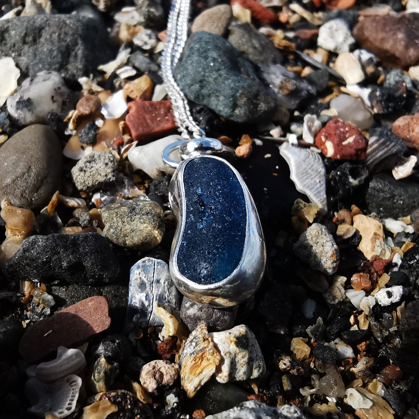 Teal blue 'jelly bean' sea glass & sterling silver pendant.