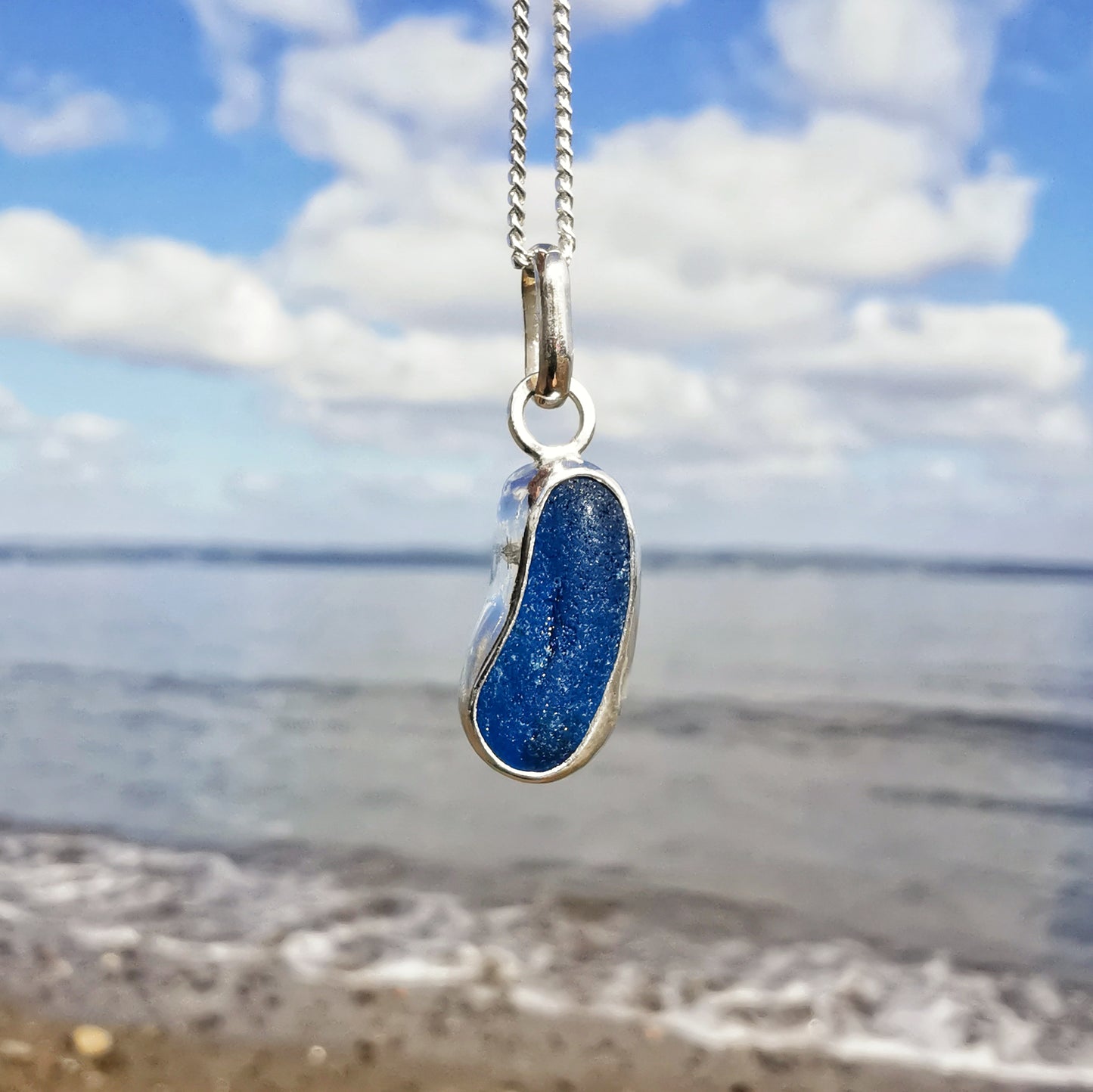 Teal blue 'jelly bean' sea glass & sterling silver pendant.