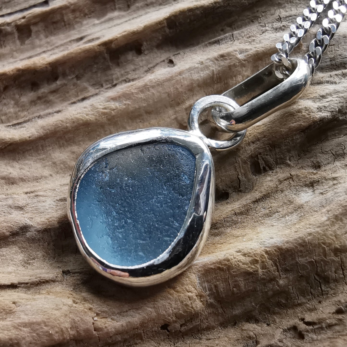 Seaham blue sea glass & sterling silver pendant.