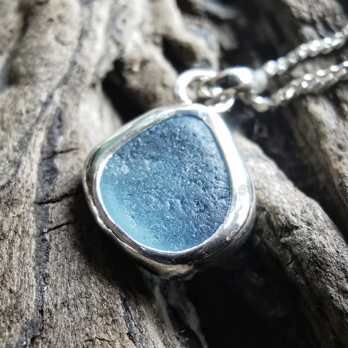 Seaham blue sea glass & sterling silver pendant.