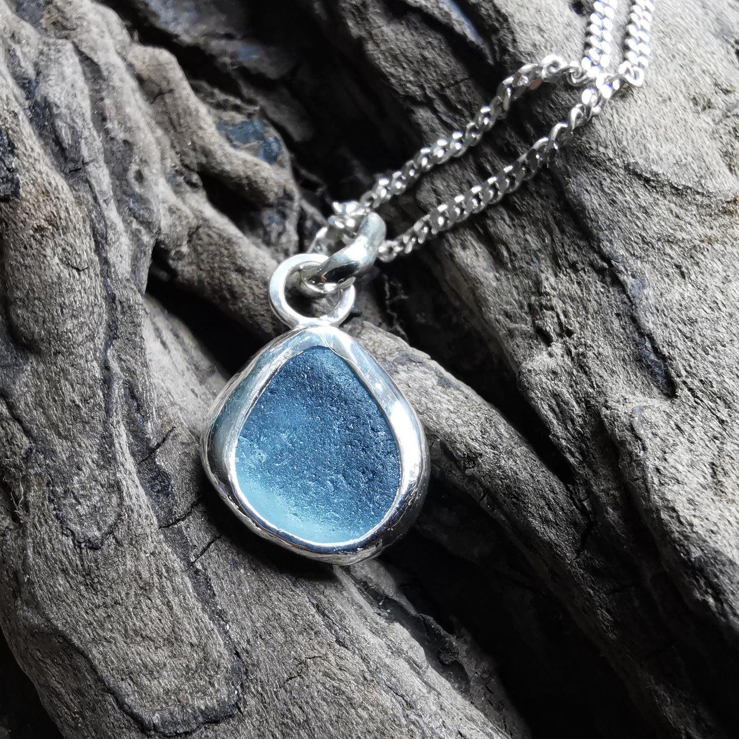 Seaham blue sea glass & sterling silver pendant.