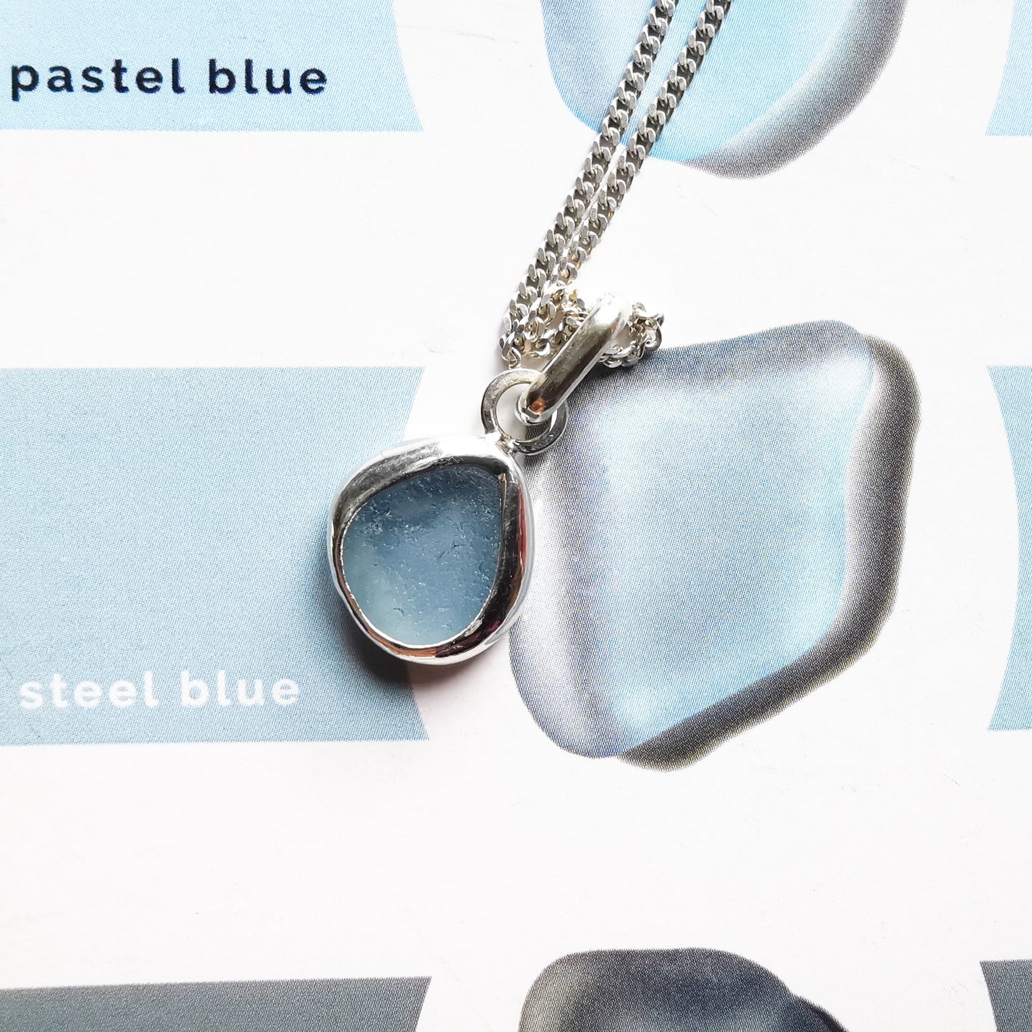 Seaham blue sea glass & sterling silver pendant.