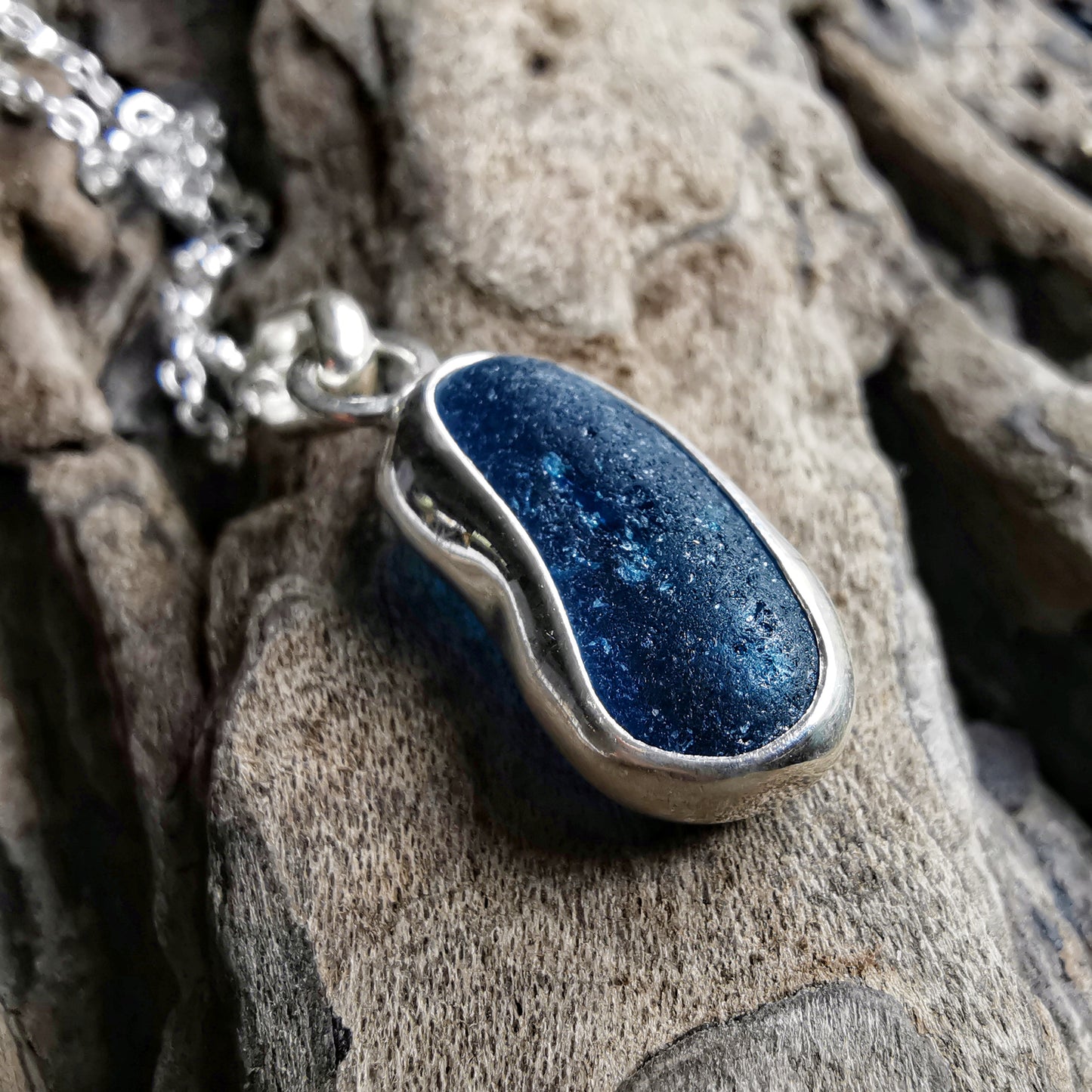 Teal blue 'jelly bean' sea glass & sterling silver pendant.