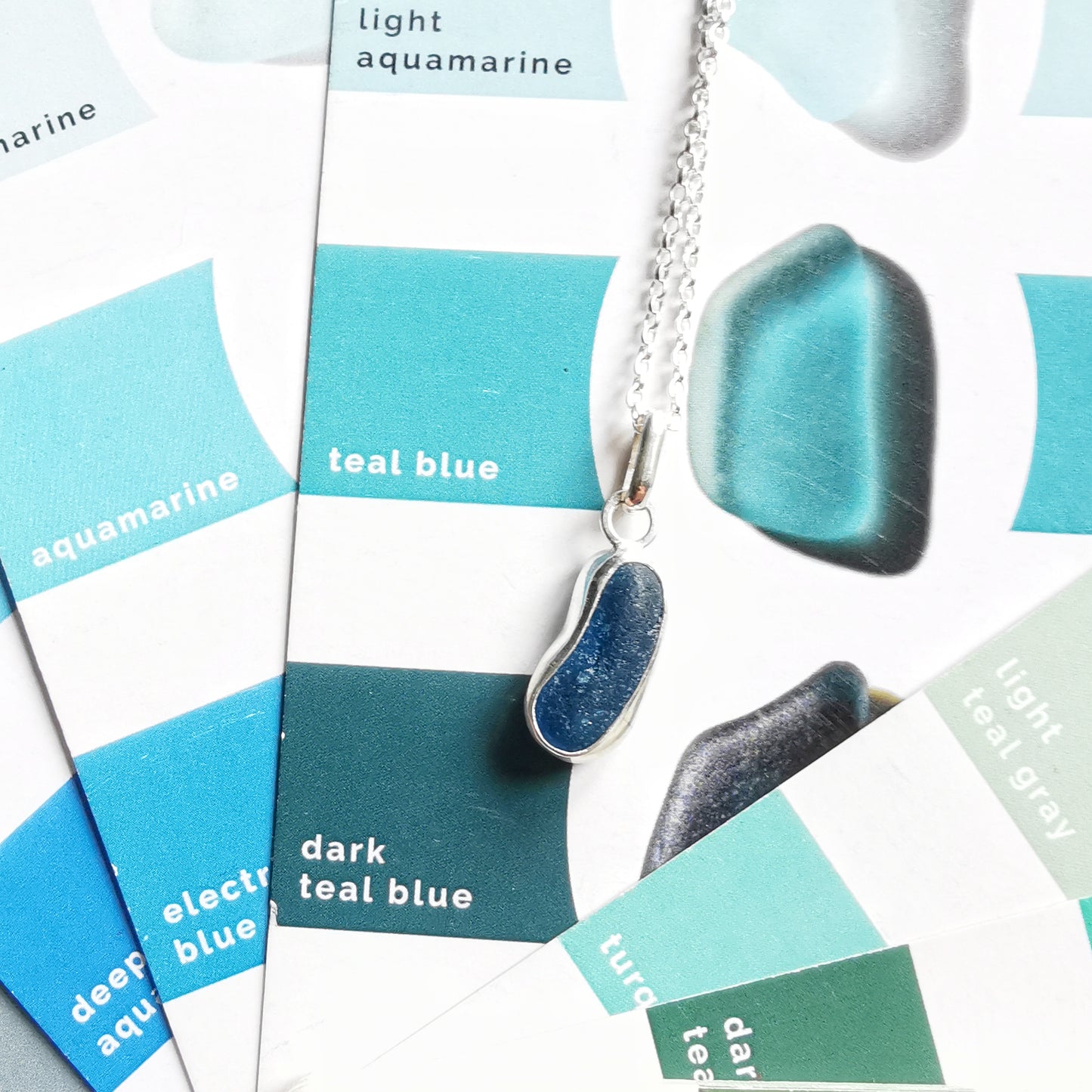 Teal blue 'jelly bean' sea glass & sterling silver pendant.