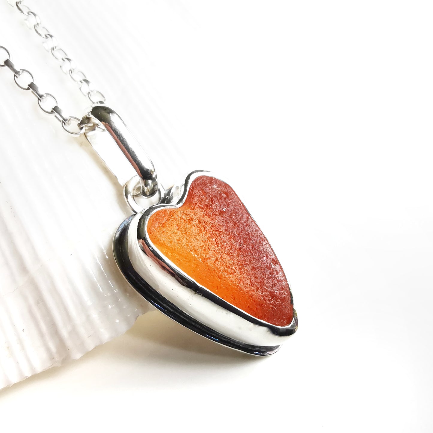 Scottish orange UV sea glass heart & sterling silver pendant.