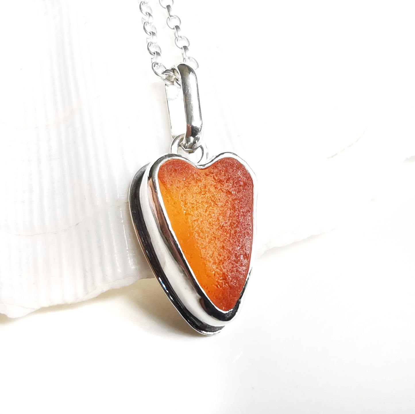 Scottish orange UV sea glass heart & sterling silver pendant.