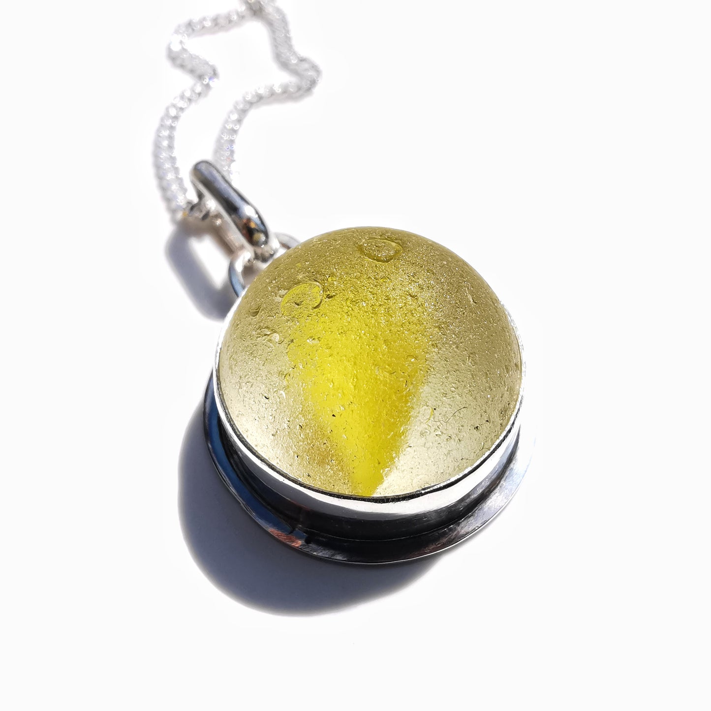 Scottish partial yellow sea glass marble & sterling silver pendant.