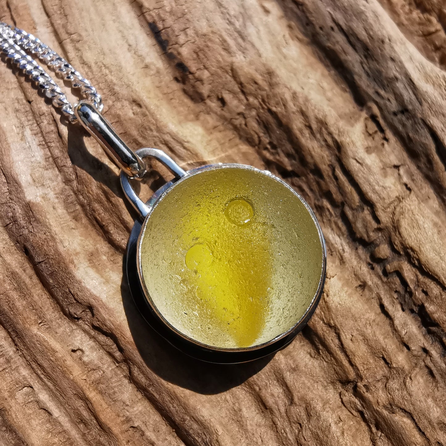 Scottish partial yellow sea glass marble & sterling silver pendant.