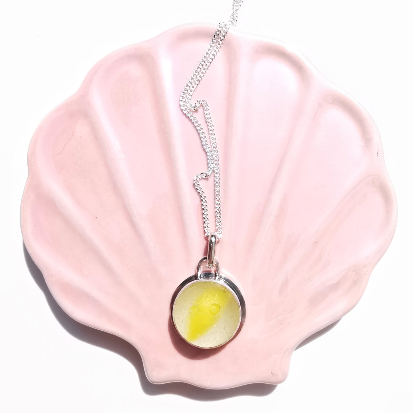 Scottish partial yellow sea glass marble & sterling silver pendant.