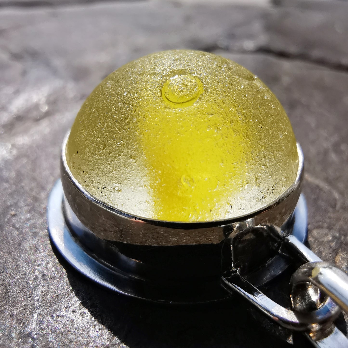 Scottish partial yellow sea glass marble & sterling silver pendant.