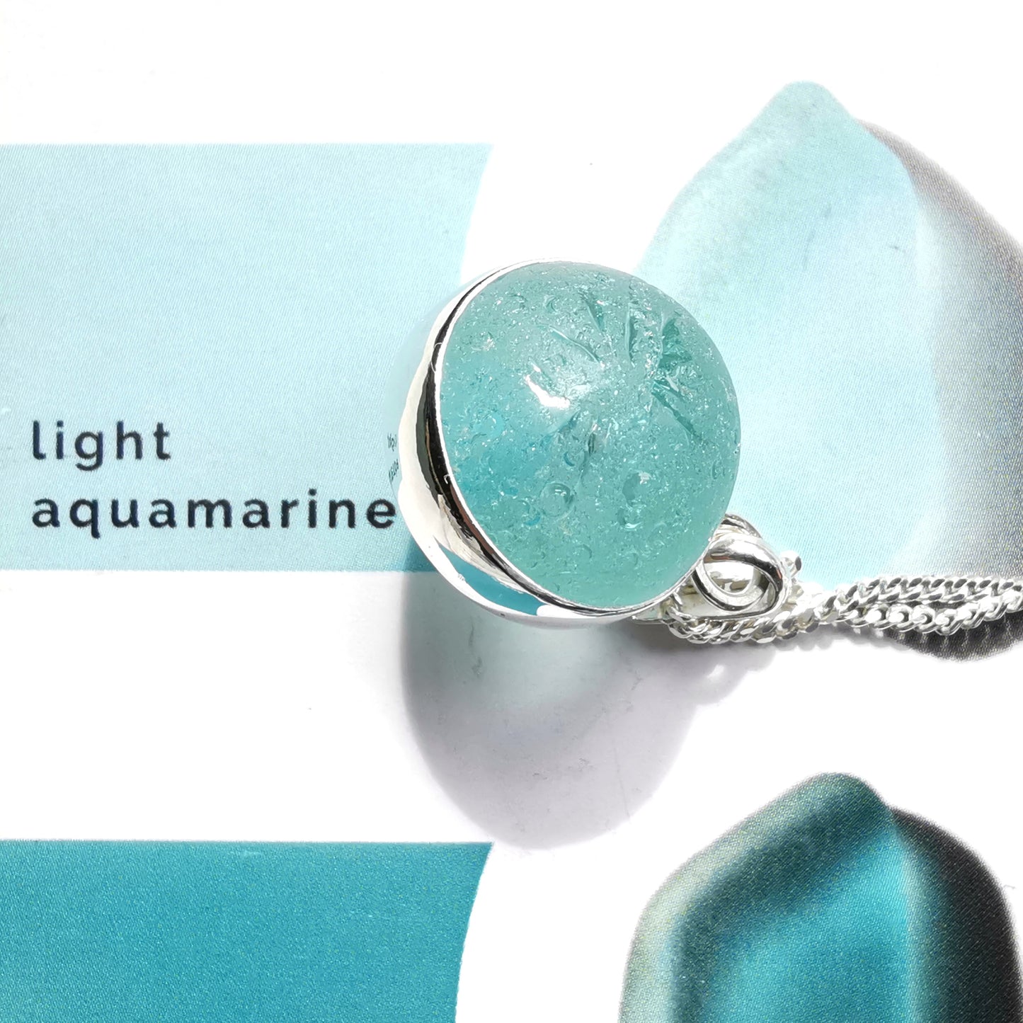 Scottish light aqua blue sea glass marble & sterling silver pendant.