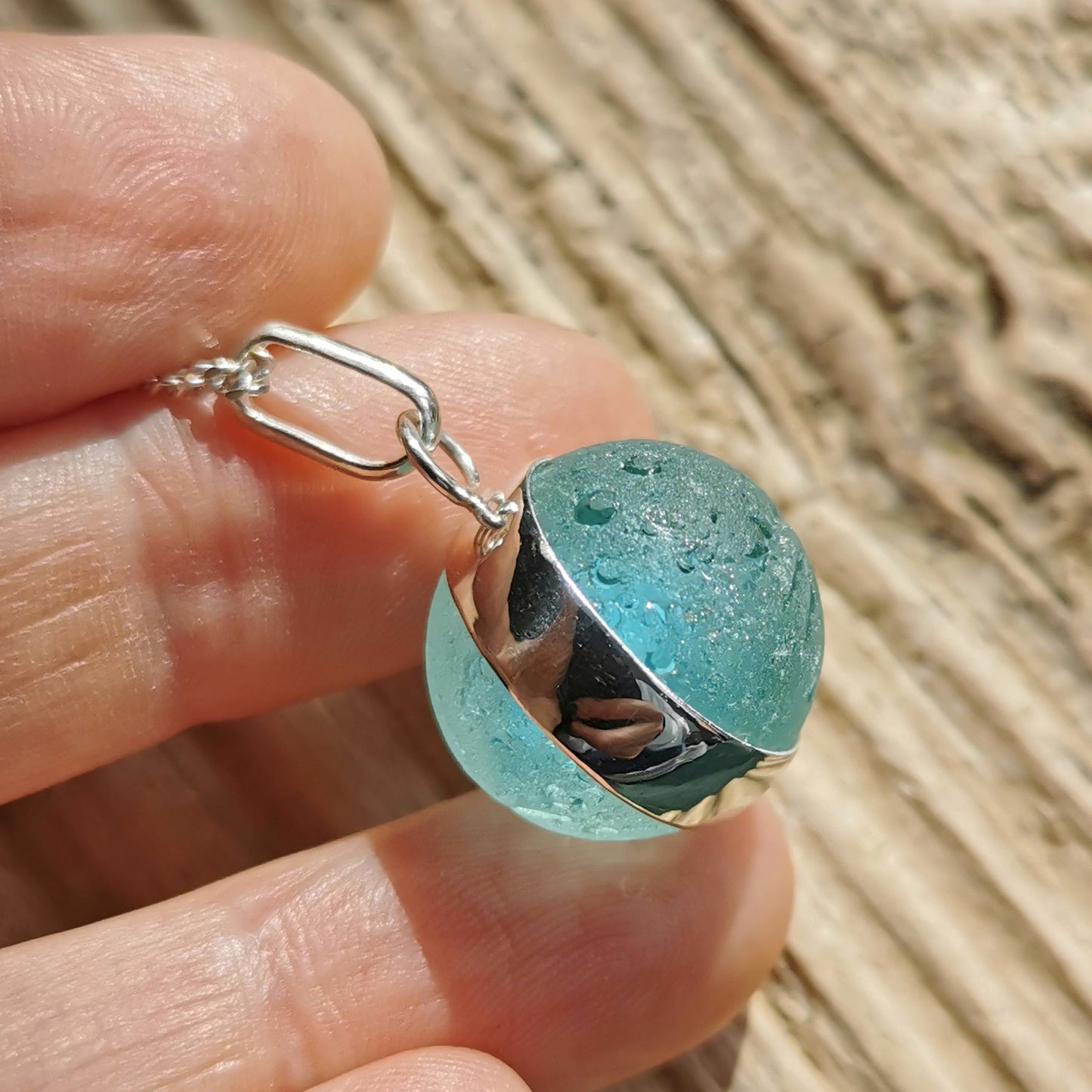 Scottish light aqua blue sea glass marble & sterling silver pendant.