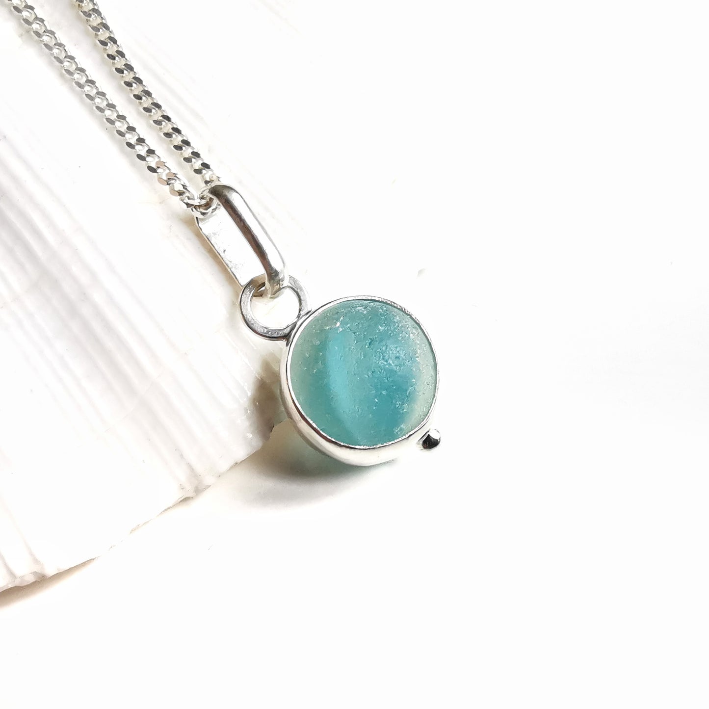 Tiny Seaham aqua blue sea glass marble & sterling silver pendant.