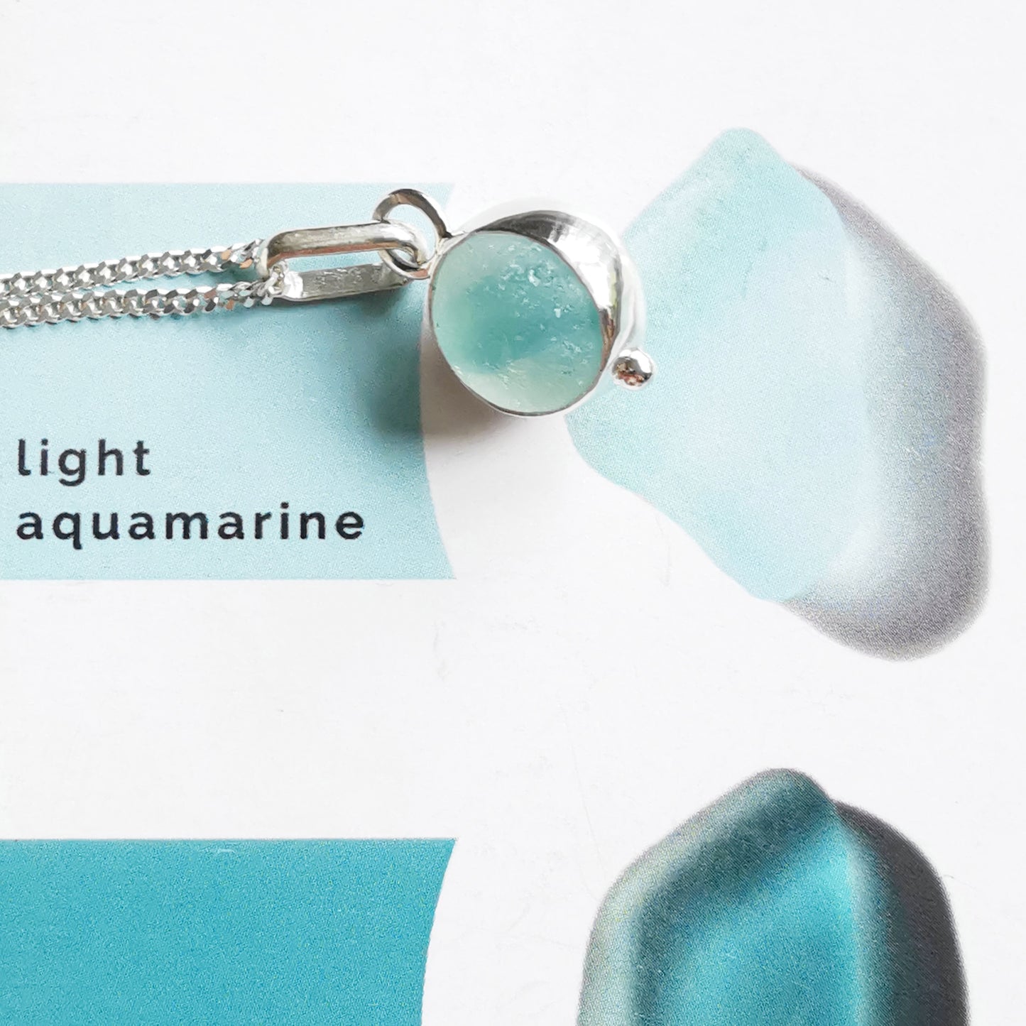 Tiny Seaham aqua blue sea glass marble & sterling silver pendant.